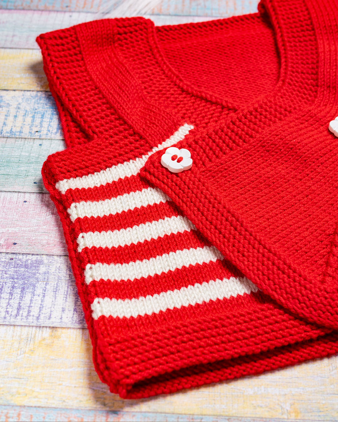 RDEČI TELOVNIK Z ROŽICO (4-7mesecev)